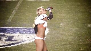 Guzzling her delicious beer on the football field