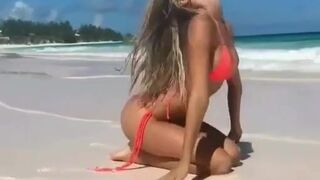 Posing on the sandy beach - Alexis Ren