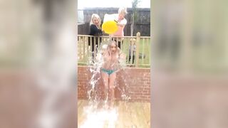 Flashing And Flaunting: Topless ice-bucket defiance with family around?