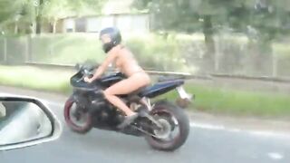 Flashing And Flaunting: topless motobike