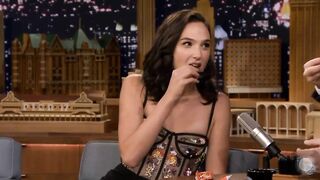 Gal Gadot eating a Reese's PB Cup for the first time.