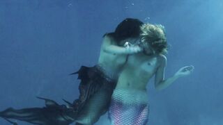 Gals Giving a kiss: Mermaids