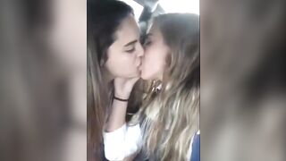 Gals Giving a kiss: Young couple making out in a car
